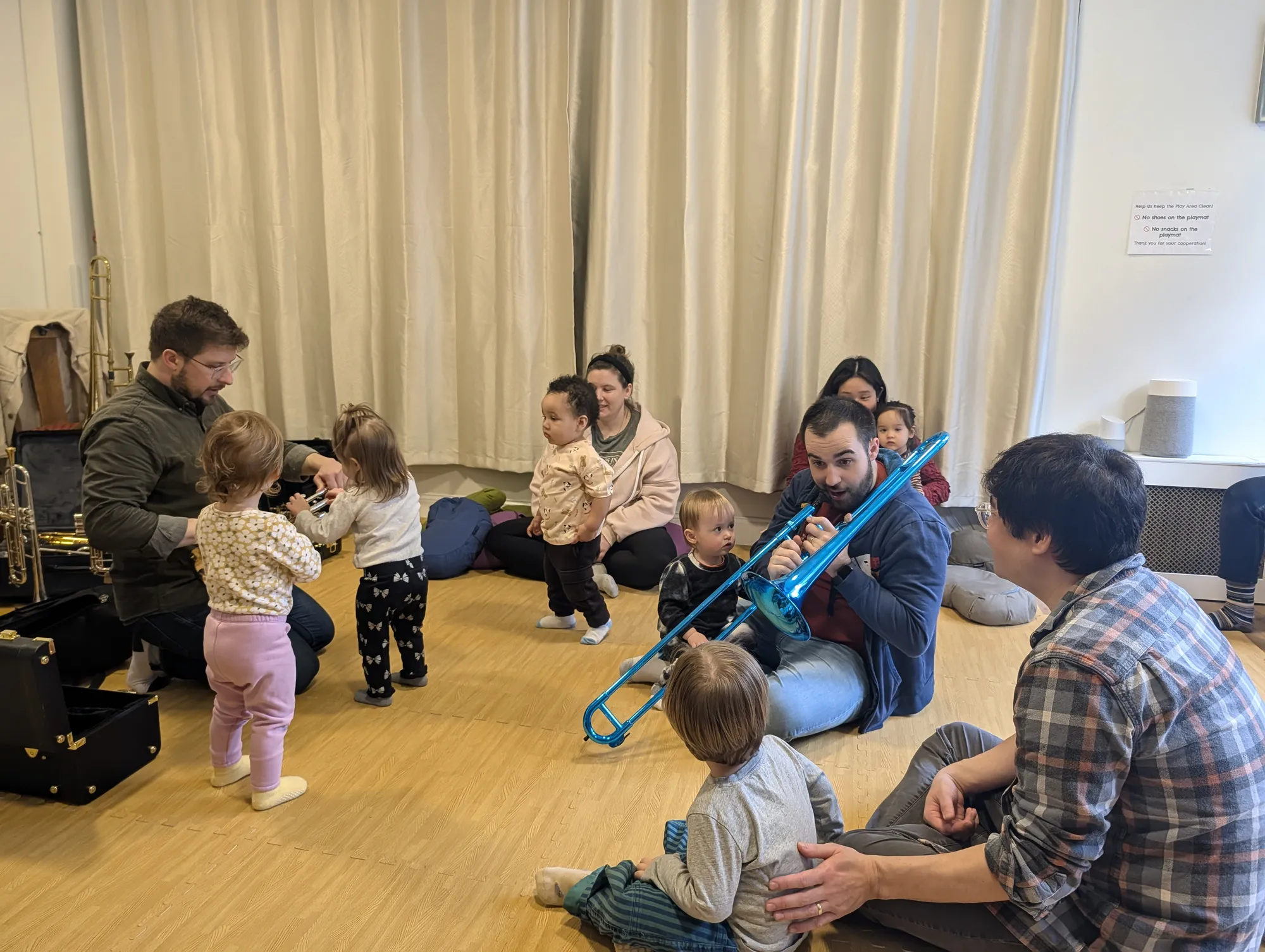 Children exploring brass instruments with Cortelyou faculty